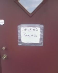 "smoking permitted" sign on the door of nite trax in hillsville, pa